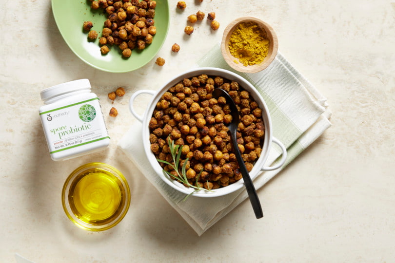 Spore Probiotic powder bottle next to Chickpeas recipes
