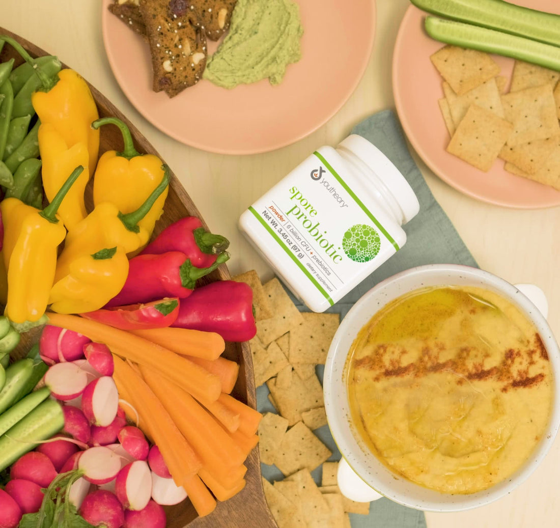 Spore Probiotic powder bottle next to Roasted Squash Dip