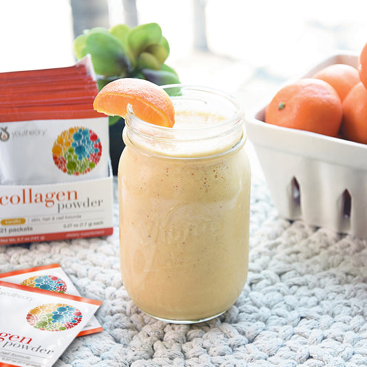 Collagen Powder Packets next to Sunburst Smoothie